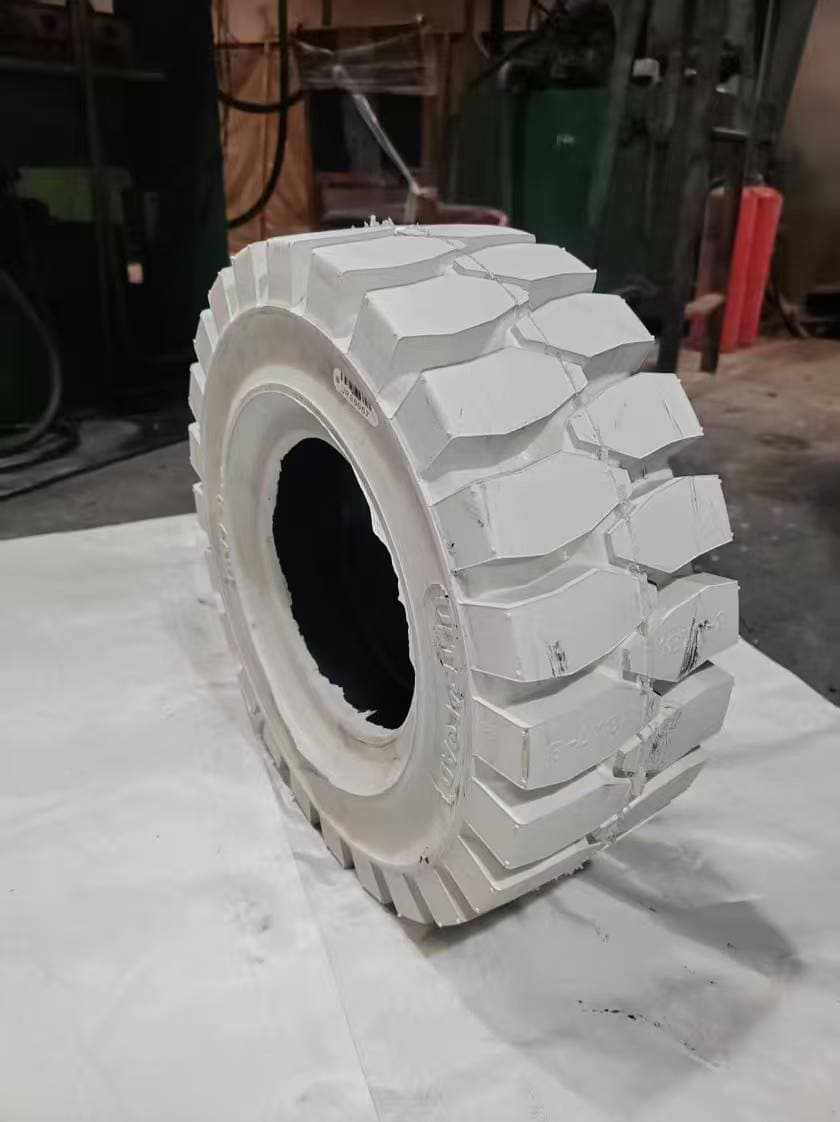 Specialised white non-marking solid forklift tyre